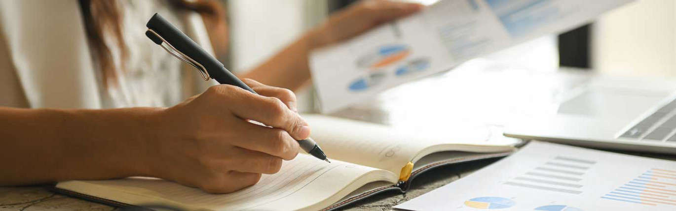 Business women are checking the company performance chart.